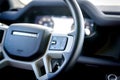 Russia, Rostovskaya oblast, 2021 June 09: Cruise control switches on steering wheel of New Land Rover Defender is a four