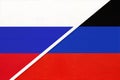 Russia or Russian Federation and Donetsk People`s Republic or DNR, symbol of two national flags from textile
