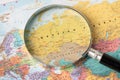 Russia, or the Russian Federation, Magnifying glass close up with colorful world map
