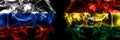 Russia, Russian vs Bolivia, Bolivian flags. Smoke flag placed side by side isolated on black background Royalty Free Stock Photo