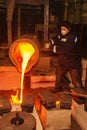 Russia, Ryazan 14 Feb 2019 - worker pours remnants of molten metal in factory of metal casting process