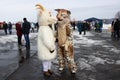 Russia. Rybinsk 1. march. 2020. National holidays and customs. A stuffed goat in the foreground. Masked mummers in the background