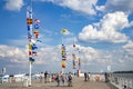 A pier with many international flags in the Gulf of Finland on Baltic Sea