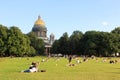 Russia, Saint Petersburg August 21, 2020 People relax in the summer on the grass in front of St. Isaac's Cathedral