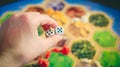 Russia/Saint-Petersburg -30.10.2019: Board game party with my friends. Playing cards. Settlers of Catan popular board game for eve