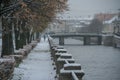 Russia, Saint Petersburg, cloudy autumn day, snowy embankment, view of the water and the bridge,