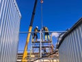 RUSSIA, SAINT PETERSBURG - JULY 10, 2022: The work of builders on the erection of a frame from metal structures