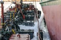 Discharge of ballast water on the deck of an oil tanker in the bay in the port