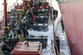 Discharge of ballast water on the deck of an oil tanker in the bay in the port