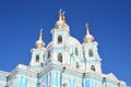 Russia, Saint-Petersburg. Smolny Cathedral in winter day. It`s snowing, snowflakes in the sky