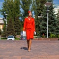RUSSIA, SAMARA: 08 AUGUST 2019. Sexy stewardess dressed in official red uniform of Aeroflot Airlines
