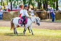 Samara, August 2018: Children in Russian national costumes sit on a pony Royalty Free Stock Photo