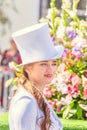 Portrait of a girl in a festive costume at the procession `Flower Festival