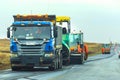 highway repair with a lot of special equipment on a summer day