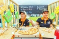 blonde girls sell pizza in a small summer cafe on the Volga river embankment on a summer day.