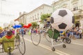 A clown on an unusual bike rides along Kuibyshev street at the carnival dedicated to the World Cup
