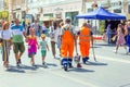 Community workers are walking along the street with a tool in their hands at work