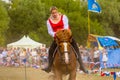 Cossack performs stunts on a galloping horse Royalty Free Stock Photo