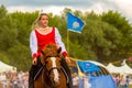 Cossack performs stunts on a galloping horse Royalty Free Stock Photo