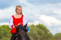Cossack performs stunts on a galloping horse Royalty Free Stock Photo