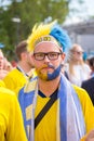 Football fans from Sweden with painted faces in national colors before the match England Sweden at the World Cup