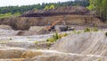 a large kaolin quarry near the city of Kyshtym, Chelyabinsk region. loading the Kamaz truck with an excavator