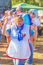 Mature Komsomol members dance on the military-patriotic site of the Grushinskaya Polyana