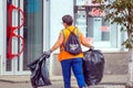 Public service workers clean up the street on a sunny summer day