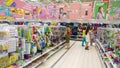 shoppers, children, woman choose stationery for school in supermarket.