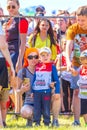 children in a sports uniform are worried before the start in city competitions to overcome obstacles. Text in Russian: race of he Royalty Free Stock Photo