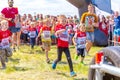 children in a sports uniform are worried before the start in city competitions to overcome obstacles. Text in Russian: race of he