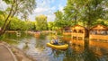 people go boating on a reservoir in Gagarin`s Park on a summer sunny day