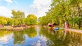 people go boating on a reservoir in Gagarin`s Park on a summer sunny day