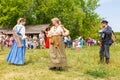 Russian peasant women lead dance to the accordion music for the audience