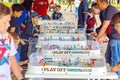 Young people play table hockey in Gagarin Park on a sunny summer day