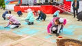 Children draw with chalk on the pavement