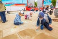 ÃÂ¡hildren paint with colored chalk on asphalt on a city holiday