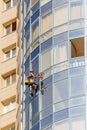 Washing the mirror facade of the building