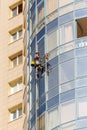 Washing the mirror facade of the building