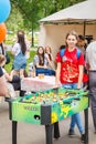 young beautiful girl playing table tennis in Gagarin`s Park on a spring sunny day