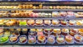 a showcase of a large supermarket with biscuit cakes.