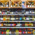 A wide selection of champagne and wine in the department of alcoholic beverages in the supermarket.