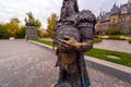 sculptures of a Scandinavian warrior in armor holding a battle ax in his hand. The village of Khryashchevka