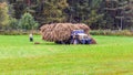 The mowers load the hay into a large lorry Royalty Free Stock Photo