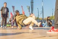 Youth street dances. A young man performs dance moves Royalty Free Stock Photo