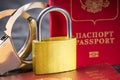 Russia Sanctions and Ukraine war concept. Russian Federation passports with handcuffs and padlock