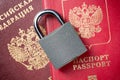 Russia Sanctions and Ukraine war concept. Russian Federation passports with padlock