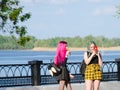 Russia Saratov region Engels may 9, 2019:bright teenage girls with pink hair on the street