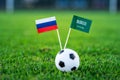 Russia - Saudi Arabia, Group A, Thursday, 14. June, Football, 2018, National Flags on green grass, white football ball on ground.