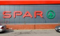 Sign-name and logo of the supermarket SPAR on the facade of the store